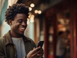 a man on a phone all jolly after knowing how to boost betting potential